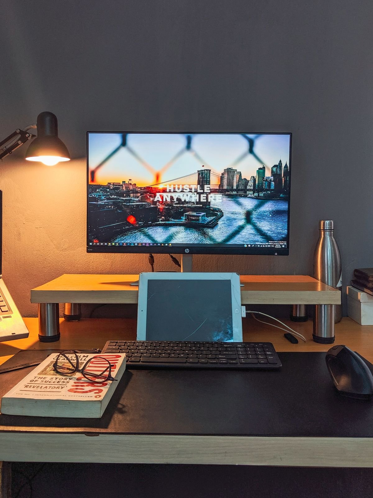 A small desk with a monitor showing the right desk size for a room