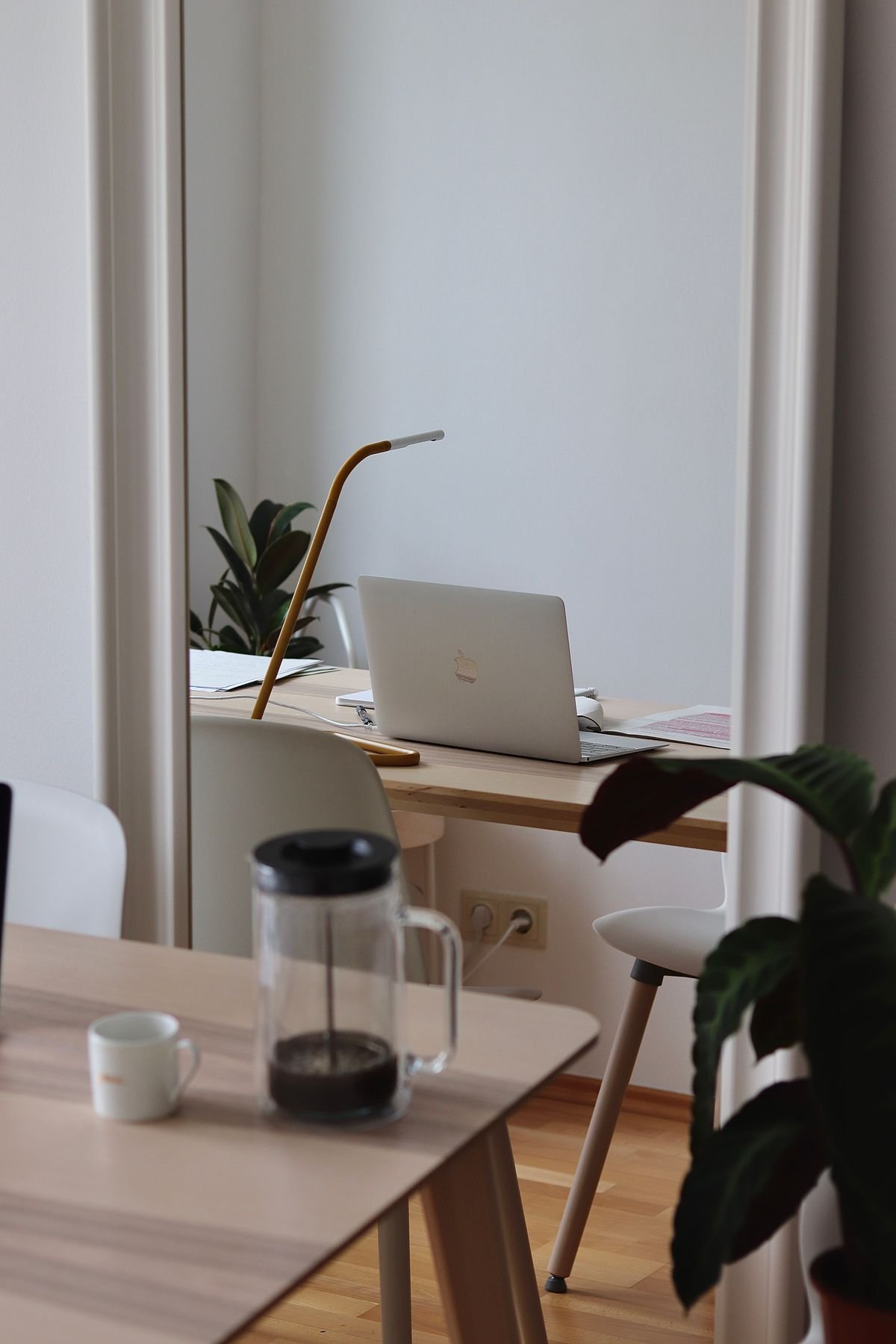 A bright, minimal compact desk in a small room