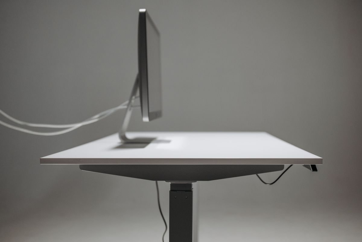 A tidy desk with neatly managed cables, seen from above