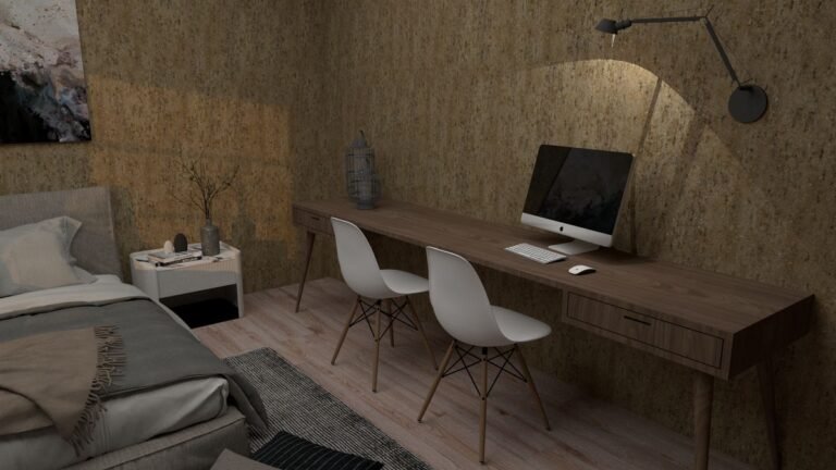 A compact desk for a studio apartment by a window with plants