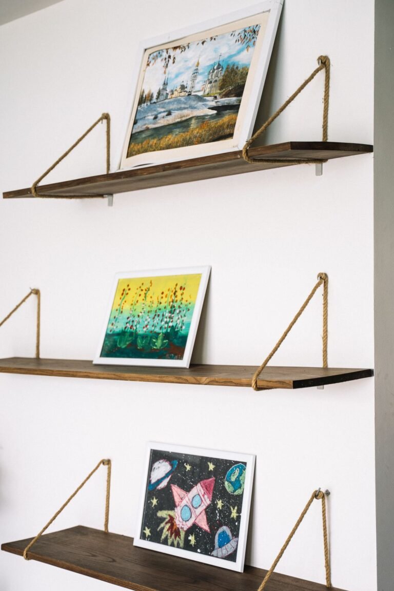 Floating wall shelves styled with books and a plant