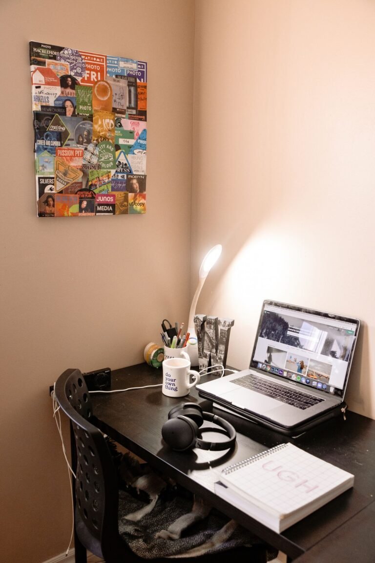 A small home office set up with a desk and plants