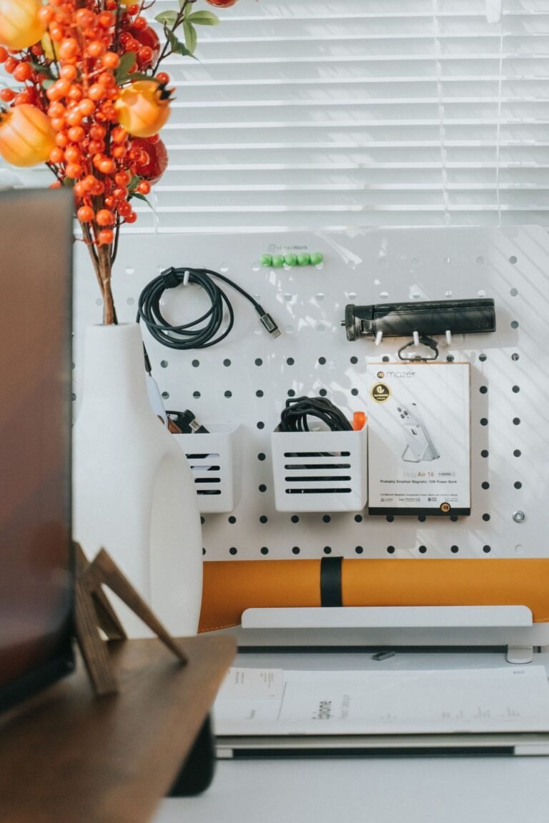 A pegboard above a desk for small-space organization
