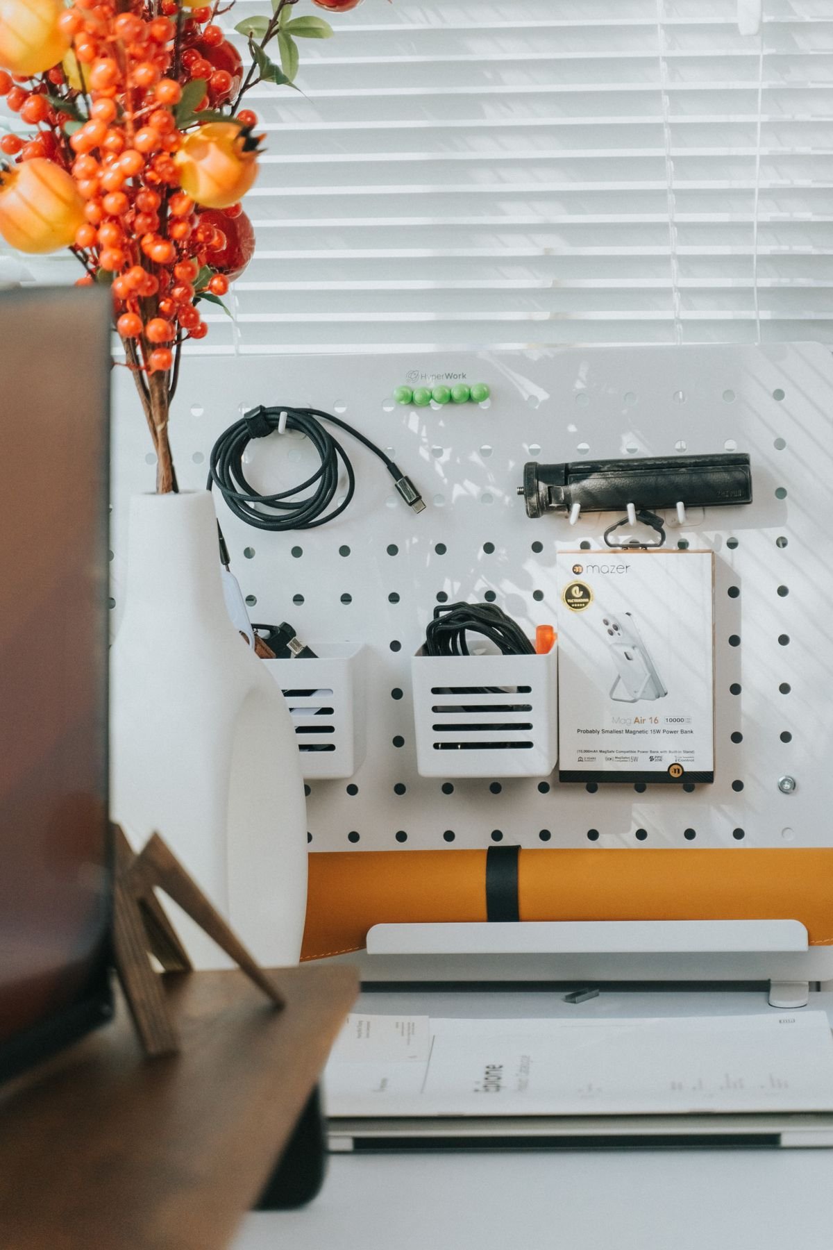 A pegboard above a desk for small-space organization