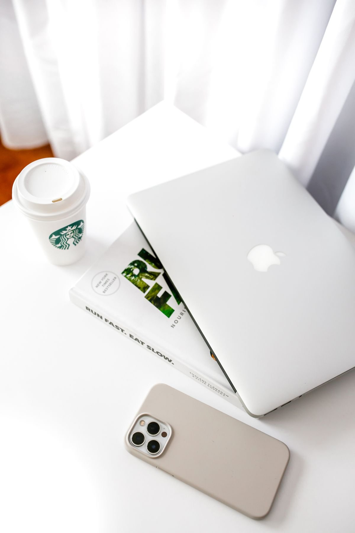 Minimalist small-space workspace with a laptop and coffee