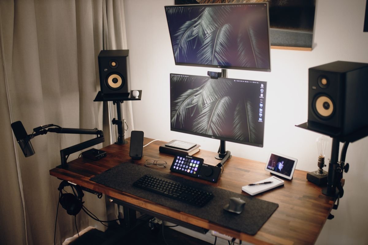 A compact mini PC workstation with a monitor on a tidy small desk